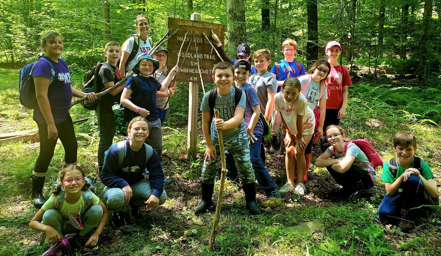 Kids hike on the Blair Hill Trail as part of the Lackawanna College Environmental Education Center’s summer camp.....